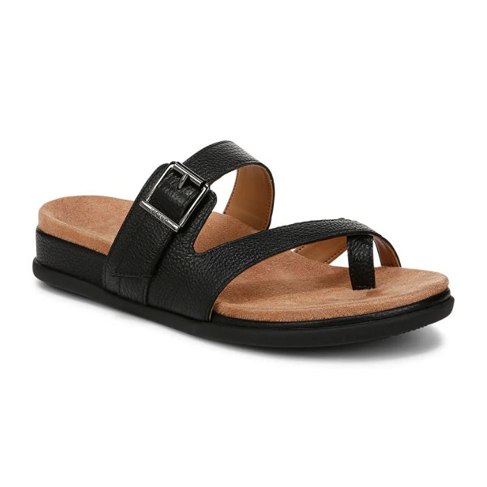 Black strappy sandal with decorative buckle and toe loop criss-cross straps on a tan suede footbed with black rubber outsole.
