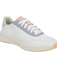 White casual sneaker with accent stitching, pale pink, green and blue accents, off-white midsole and light tan outsole.