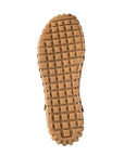 Outsole of tan lace-up shoe with square grippy tread pattern.