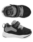 Black and gray toddler sneakers with white soles, velcro straps, and a comfy memory foam footbed shown from top and side views.