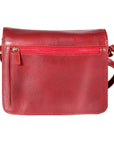 Red leather handbag with adjustable strap and zipper on back exterior
