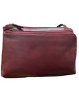 Derek Alexander Two Top Zip Front Organizer Leather Bag in burgundy, compact crossbody design with smooth leather texture.