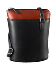 Black and brandy leather crossbody bag with contrast top panel, black straps and secure zip closure.