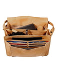 Interior of the 3/4 flap organizer bag in Buffalo, which contains a cellphone, key ring, a pen, a passport, and many credit cards across multiple compartments.