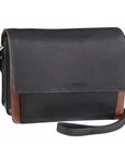 3/4 flap organizer crossbody bag in black-brandy. A black leather handbag with brown accents, a flap closure, and an adjustable shoulder strap.