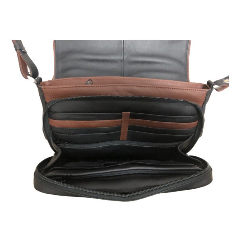 The inside of the black leather handbag has many pockets for cards, cellphone or money with brown contrasting areas for decor