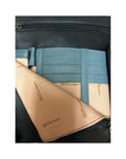 Close-up of Derek Alexander 3/4 Flap Messenger Bag interior showing multiple card slots and branded lining.
