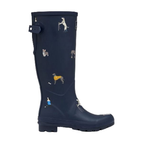 Women's Joules Tall Print Waterproof Wellies in navy with colorful dog prints. Adjustable strap and rugged sole for all-weather wear.