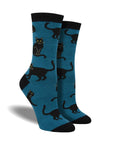 Blue socks with black accents featuring black cats sitting and walking