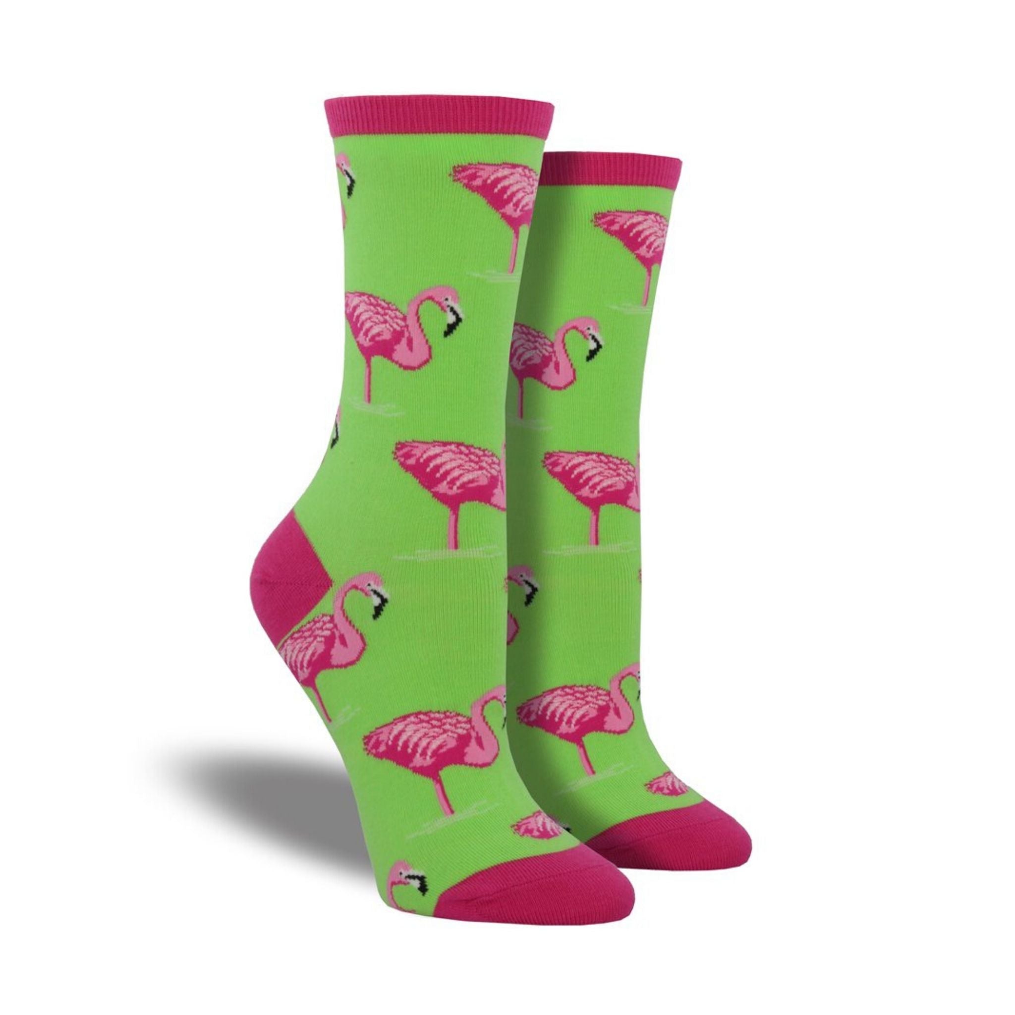 Green socks with pink accents featuring flamingos