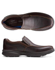 Top and side view of brown leather slip-on shoe with bicycle toe. Clarks logo on heel of insole.