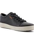 A black nubuck casual sneaker with a white midsole and brown outsole. A brown leather tag near the laces show the Ecco logo.
