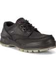 An Ecco black leather shoe with black laces and 4 pewter eyelets. Midsole is black, outsole is taupe.