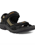 An Ecco Yucatan black and khaki coloured nubuck sandal with orange accents on velcro heel, instep and toe straps. Footbed, midsole, and outsole are black.