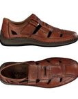 Pair of Brown leather fisherman sandals with Velcro closure and dark brown outsole.