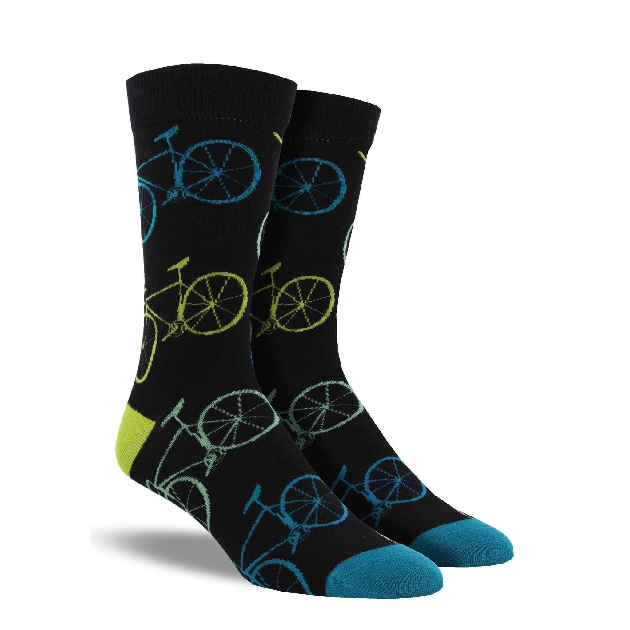 A pair of men&#39;s black crew socks with blue and lime bikes on them.