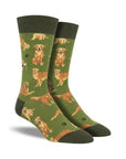 Green crew socks with golden retriever dog pattern and dark green cuff, heel and toe caps.