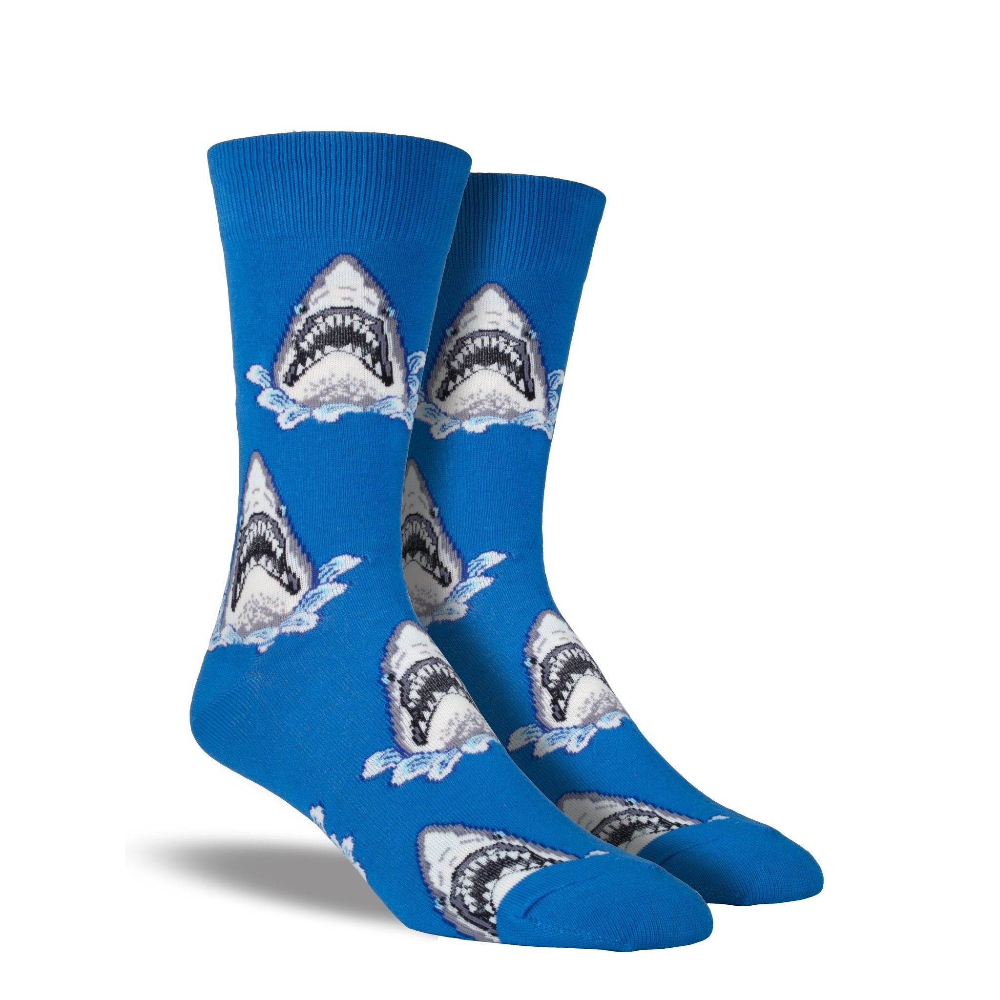 A pair of blue crew socks with sharks on them.