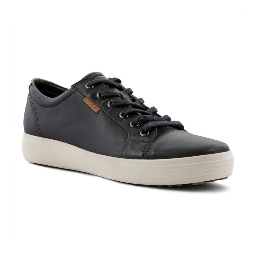 Black leather sneaker with laces and white outsole.