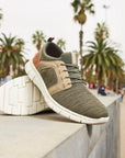 Slip-on Sneaker displayed outdoors with palm trees.