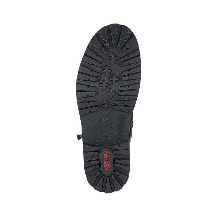 Treaded outsole of black leather boot