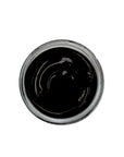 Black shoe cream polish in clear jar