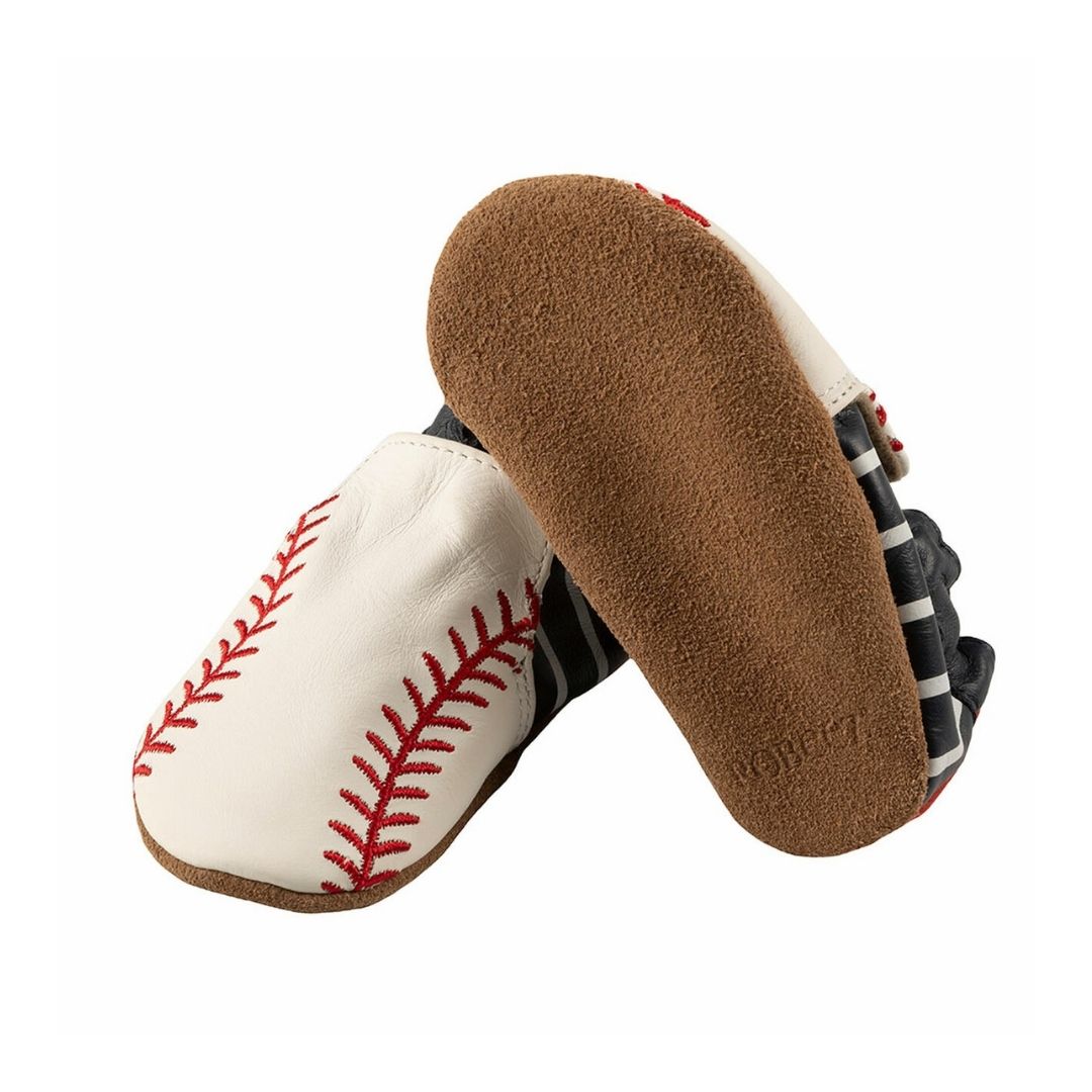 Bottom view of Robeez Robinson soft sole baby shoes with suede soles and baseball-themed leather upper for barefoot-like comfort.