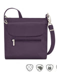 Purple crossbody bag with front flapped pocket and front horizontal zippered pocket. Bag has silver zippers and clasps