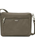 Travelon Anti-Theft Small E/W Crossbody in taupe with front zip pocket and adjustable strap, ideal for secure travel and everyday use.