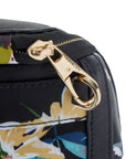 Close-up of Travelon Anti-Theft Addison Backpack zipper with gold-tone locking clip for added security during travel.