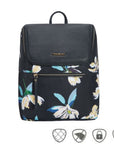 Travelon Anti-Theft Addison Backpack in floral print with front zipper pocket and sleek black flap, ideal for travel and daily use.