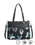Travelon Anti-Theft Addison Tote in floral print with dual handles and crossbody strap, ideal for travel and everyday use.