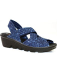 A blue jean Bernie Mev Lihi Brighten sandal with woven elastic upper, a heel strap, an open toe and a black wedge outsole.