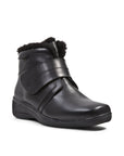 Black leather ankle boot with thick fold over Velcro strap and black faux fur trim.