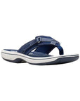 Breeze sea thong sandal in navy. Navy blue upper featuring adjustable velcro strap and a fabric toe post. Footbed is blue, midsole is white, and outsole is black.