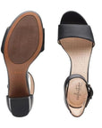 Top and bottom view of Deva Mae heeled sandal. Rubber outsole is brown. Beige footbed has small perforations for breathability.