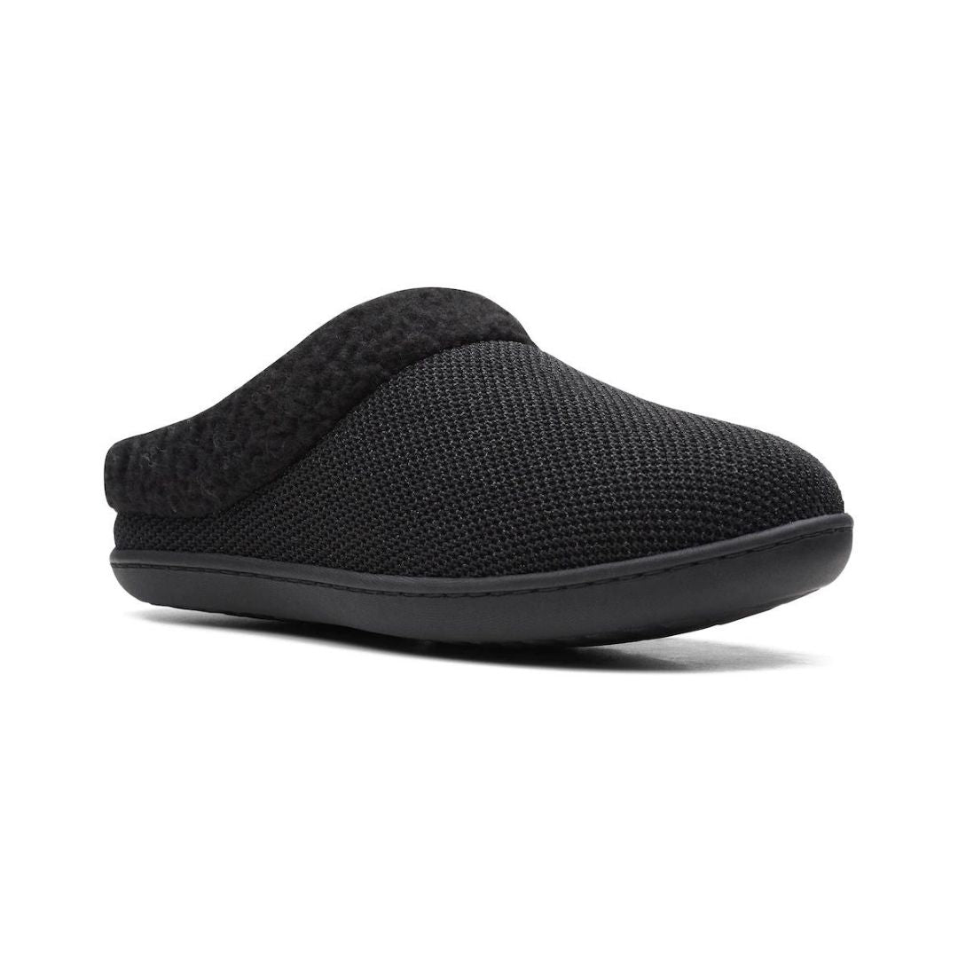 Black backless slippers with sparkly knit upper and fuzzy collar. Outsole is black.