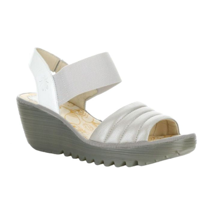 Yiko Wedge sandal in silver. Silver leather and textile upper with a grey scalloped outsole.