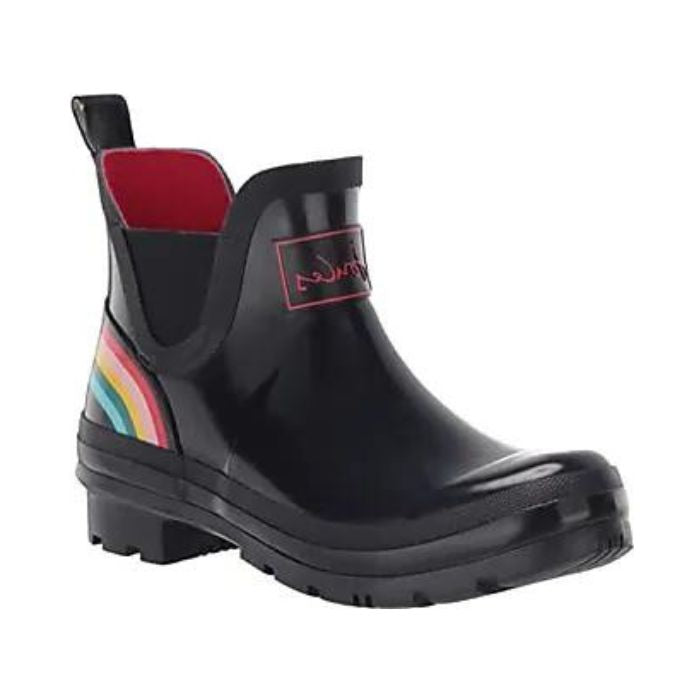 Wellibob Chelsea Boot in Navy Rainbow. Glossy blue rubber ankle boot with red accents and a rainbow that wraps around the heel. Outsole is navy blue.
