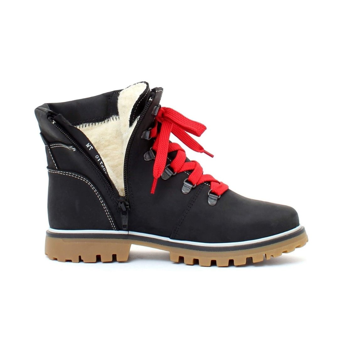 Side view of Maika Ankle Boot in black, with inside zipper undone to show white wool lining.