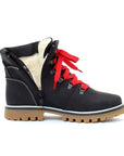 Side view of Maika Ankle Boot in black, with inside zipper undone to show white wool lining.