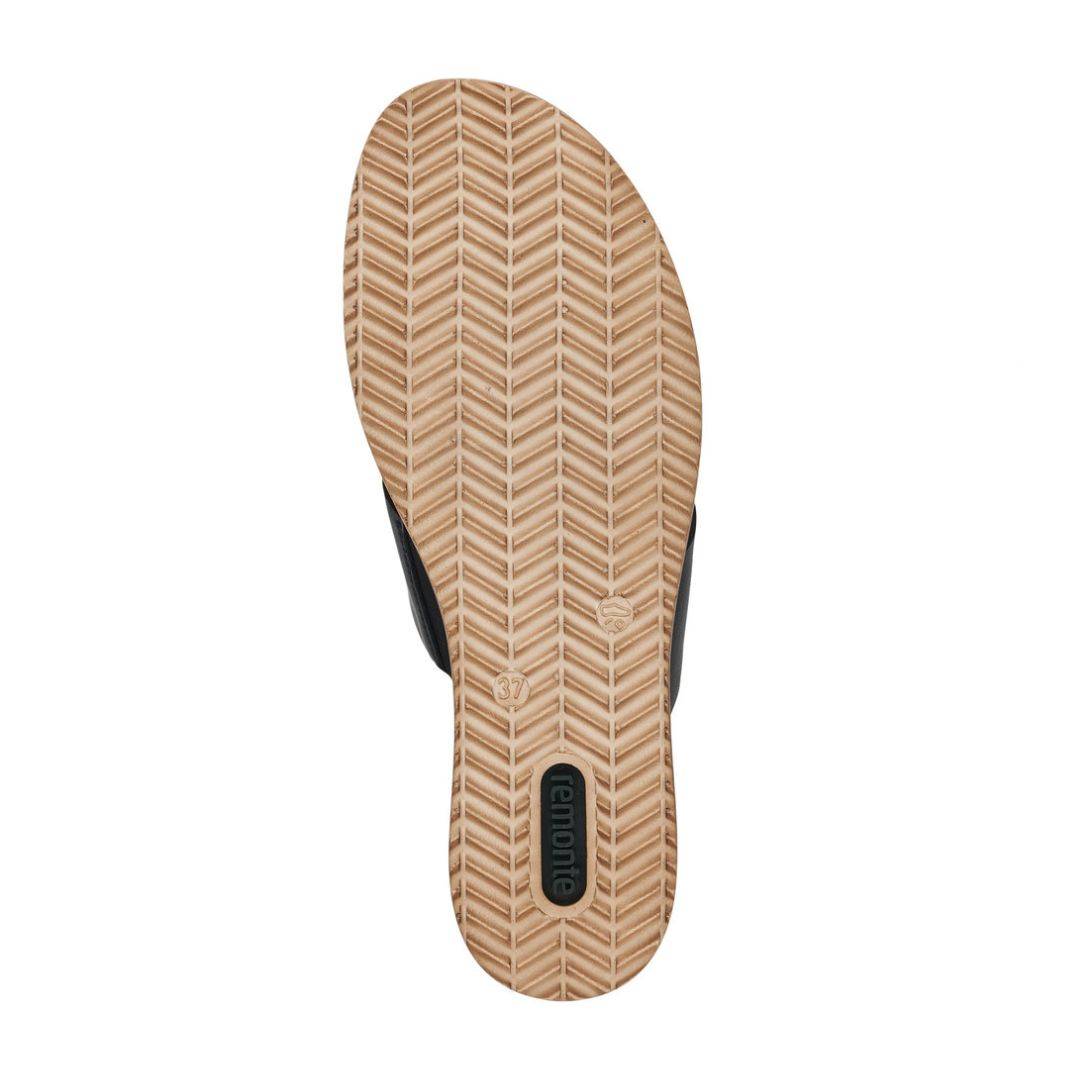 Outsole view of Rieker D6456 women's platform wedge sandal in black, showing textured grip for traction and stability.