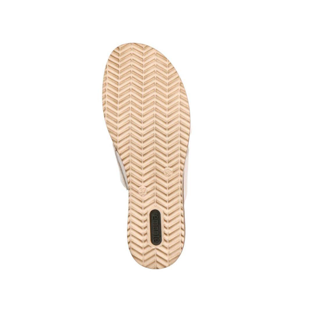 Outsole of white Rieker D6456 women's slide wedge sandal with herringbone tread pattern for enhanced grip and comfort.
