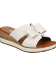 Women's Rieker D6456 slide platform wedge in white with bow detail and cushioned footbed, ideal for warm-weather style.