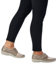 Model wearing beige Women's Remonte R7600 Velcro Shoes with floral upper, offering stylish support for casual outfits.