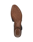 Brown light treaded outsole of navy heeled Mary-Jane with Rieker logo on heel.