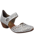 Silver heeled open sided Mary-Jane with Velcro ankle strap, floral pattern, decorative perforations and a low stacked heel.