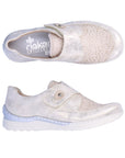 Top and side view of Women's Rieker 48951 Velcro Shoe in beige, showcasing flexible design and soft upper for all-day comfort.