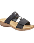 Black Slide sandal with two Velcro straps, textured details and medallion accent, tan Rieker logo'd footbed and brown outsole.