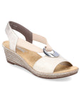 Light gold wedge sandal with straps connecting to toe with silver circle detail